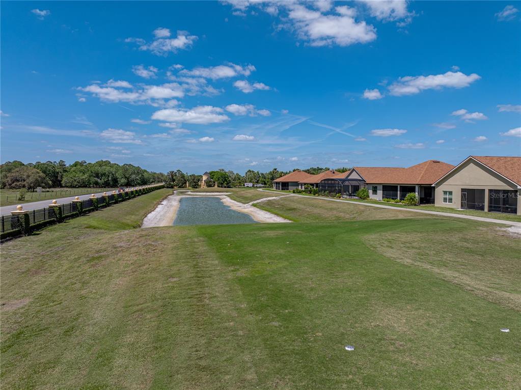 1124 Sawgrass Drive Winter Haven, FL 33859 - Photo 51 of 85 a view of a town with palm trees