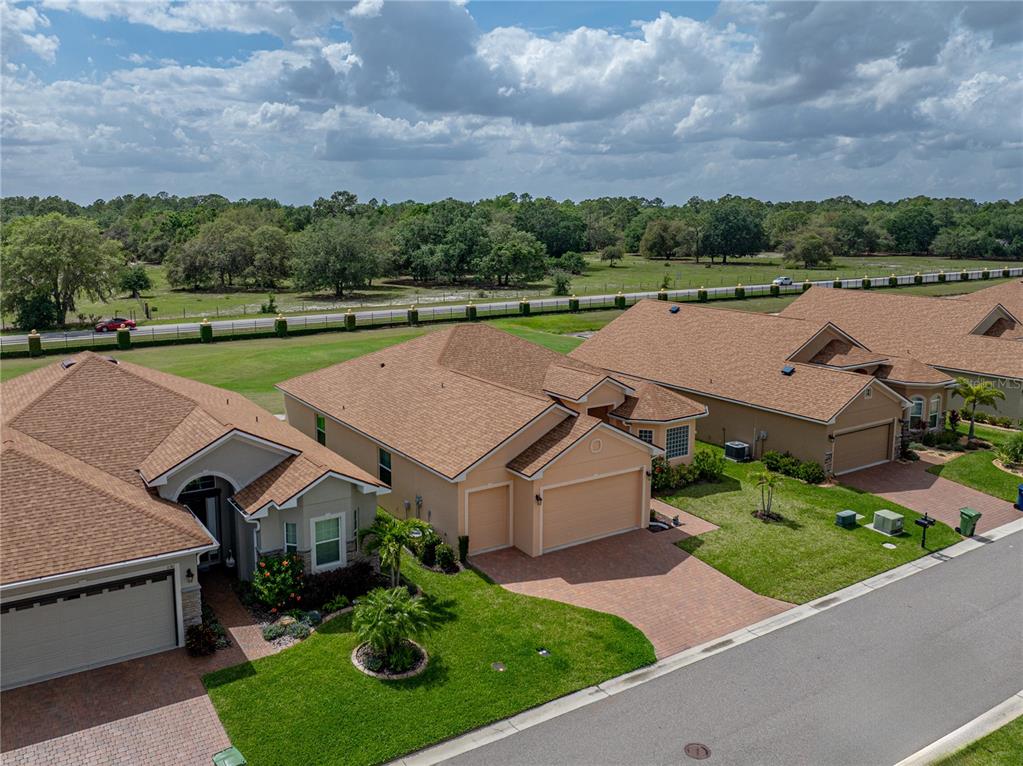 1124 Sawgrass Drive Winter Haven, FL 33859 - Photo 56 of 85 an aerial view of a house with a yard basket ball court and outdoor kitchen