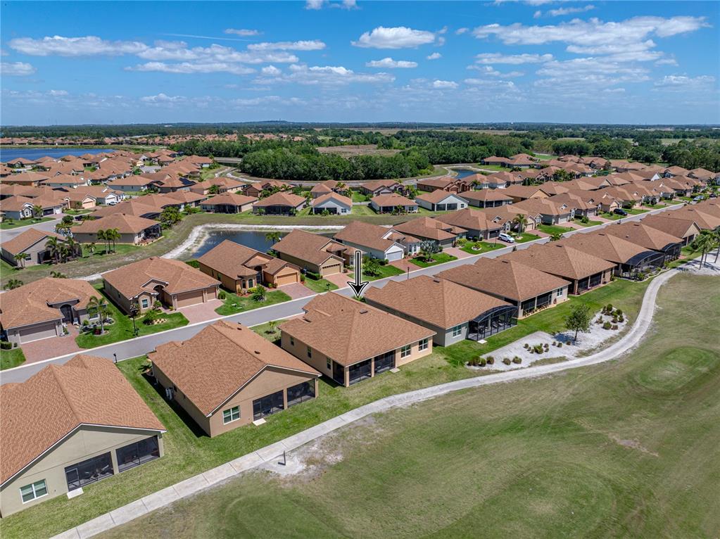 1124 Sawgrass Drive Winter Haven, FL 33859 - Photo 62 of 85 an aerial view of residential houses with outdoor space and ocean view