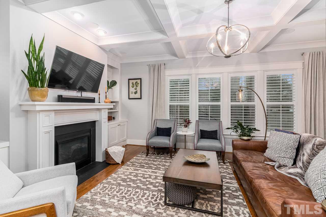 701 Virginia Avenue Raleigh, NC 27604 - Photo 5 of 16 a living room with furniture fireplace and a flat screen tv