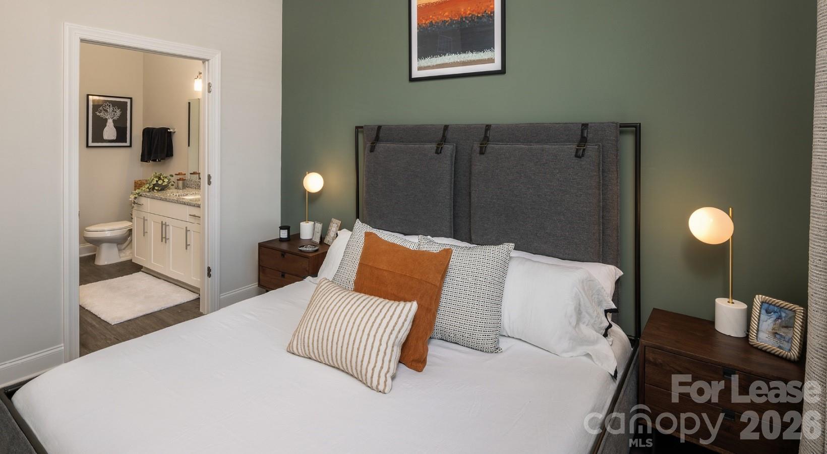 8424 North Tryon Street, Unit B2 Charlotte, NC 28262 - Photo 21 of 25 a bed room with a bed window and furniture