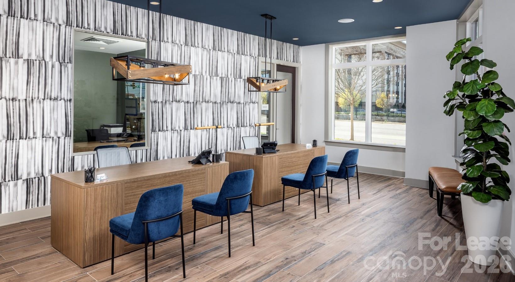 8424 North Tryon Street, Unit B2 Charlotte, NC 28262 - Photo 8 of 25 a view of a dining room with furniture window and wooden floor