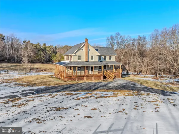 a kitchen with stainless steel appliances granite countertop a sink and a refrigerator
