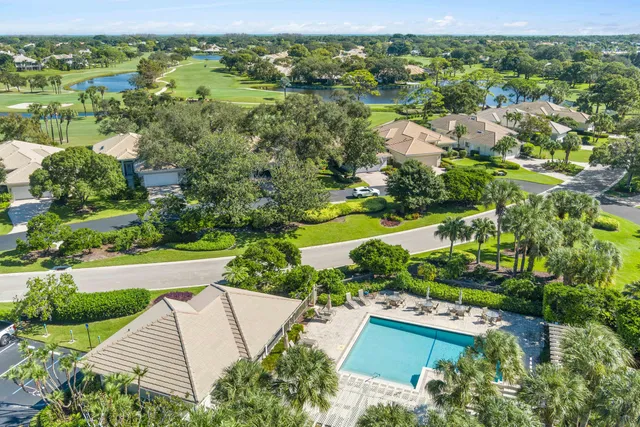 an aerial view of a house with swimming pool yard and outdoor seating