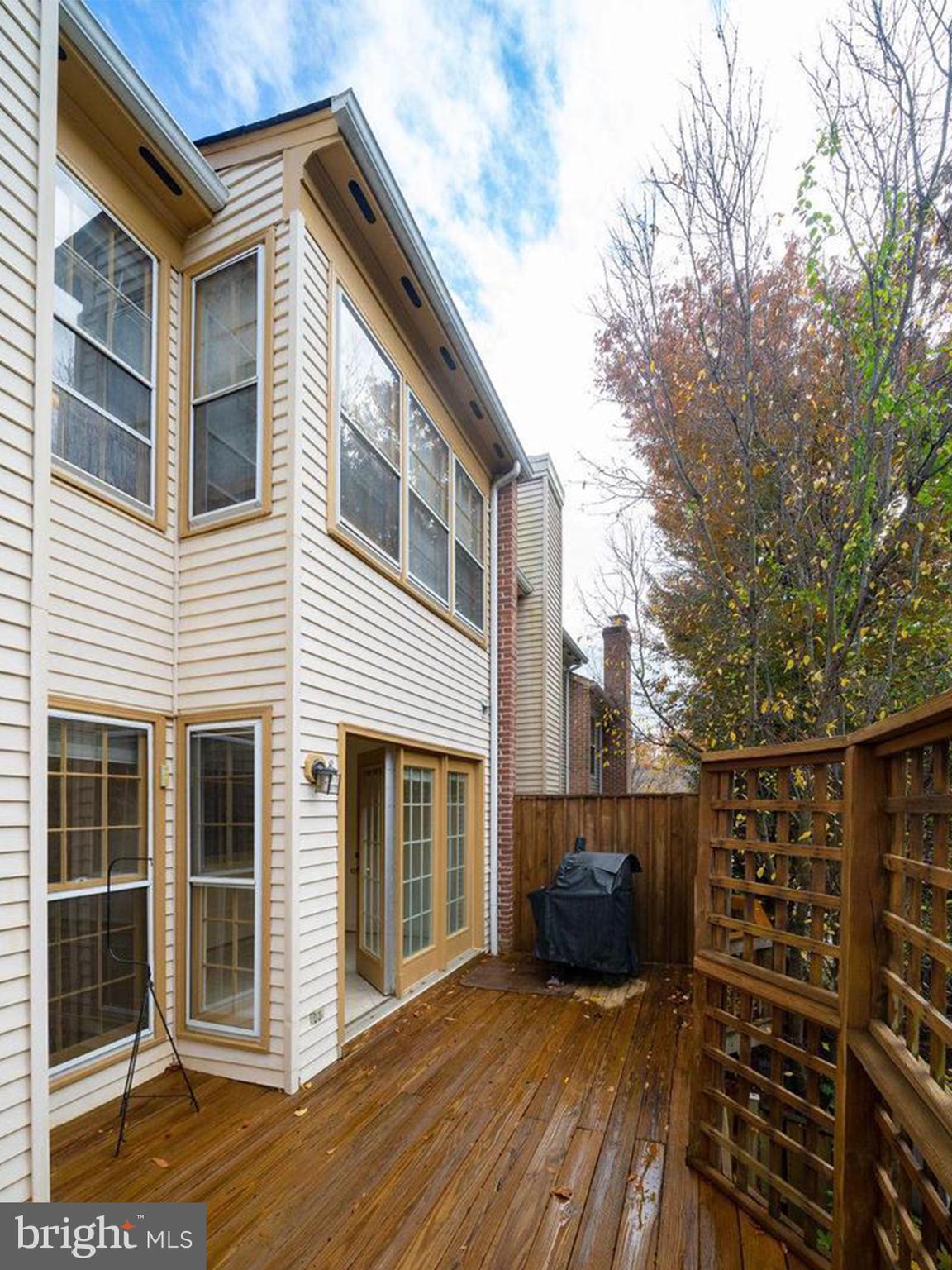 6510 Serenade Place Springfield, VA 22150 - Photo 13 of 29 a view of house with deck and wooden floor