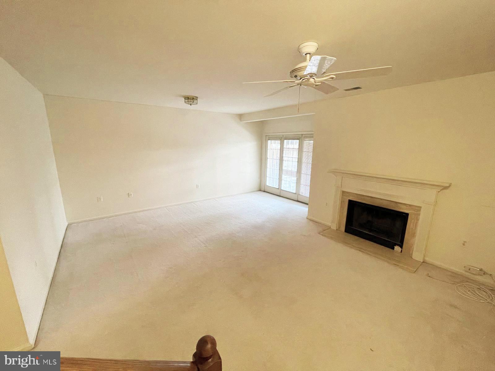 6510 Serenade Place Springfield, VA 22150 - Photo 16 of 29 a view of a livingroom with a ceiling fan and window