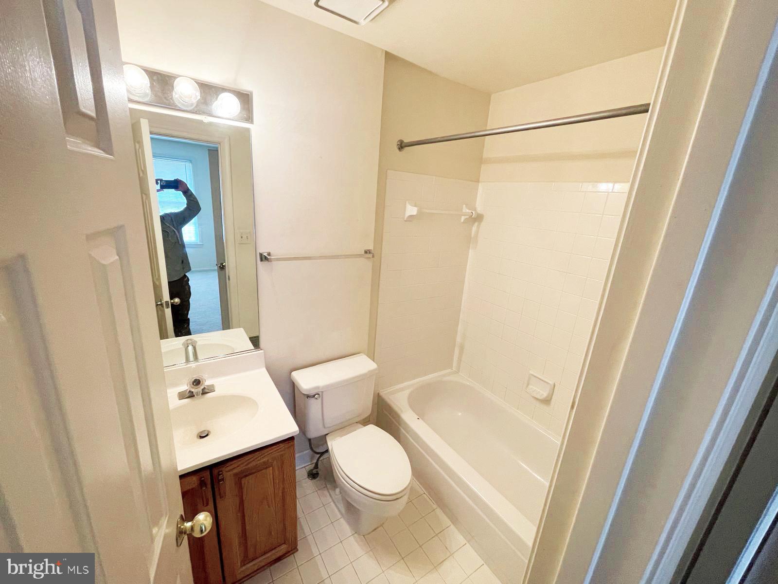 6510 Serenade Place Springfield, VA 22150 - Photo 19 of 29 a bathroom with a sink a toilet and shower
