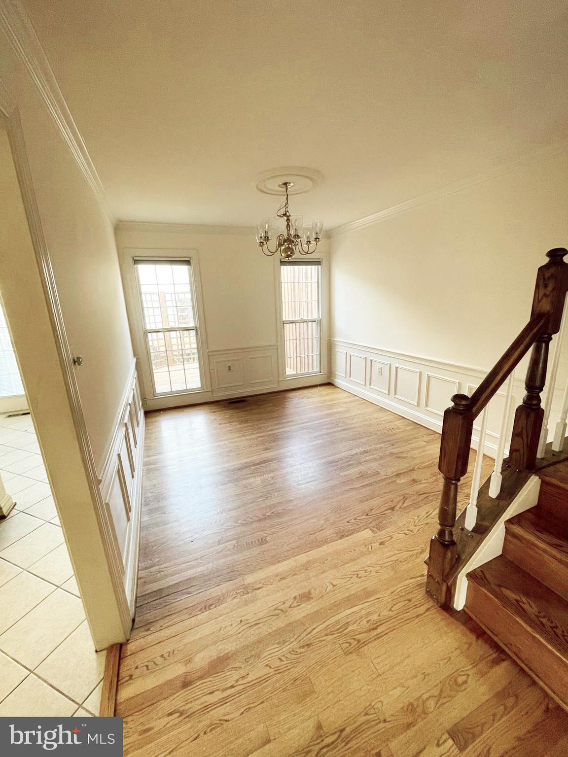 6510 Serenade Place Springfield, VA 22150 - Photo 6 of 29 a view of empty room with wooden floor and fan