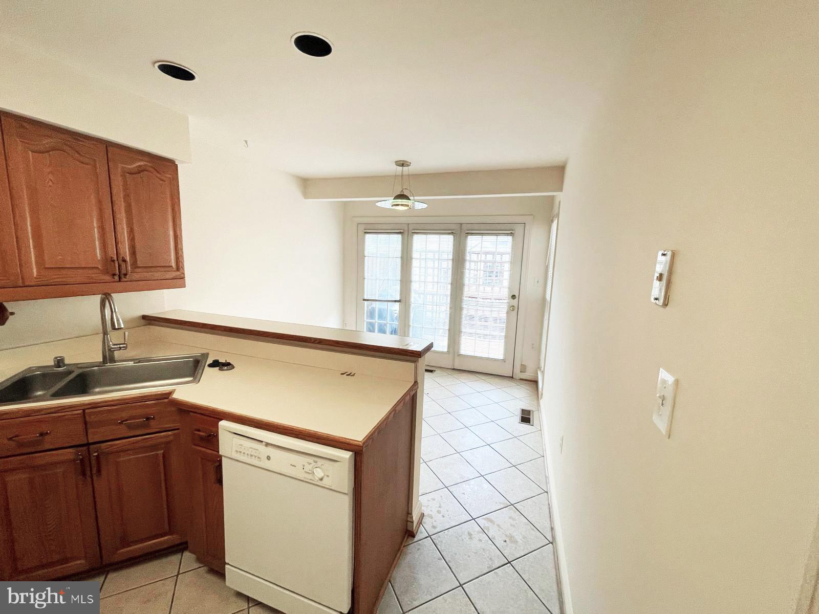 6510 Serenade Place Springfield, VA 22150 - Photo 9 of 29 a kitchen with a sink a stove and cabinets