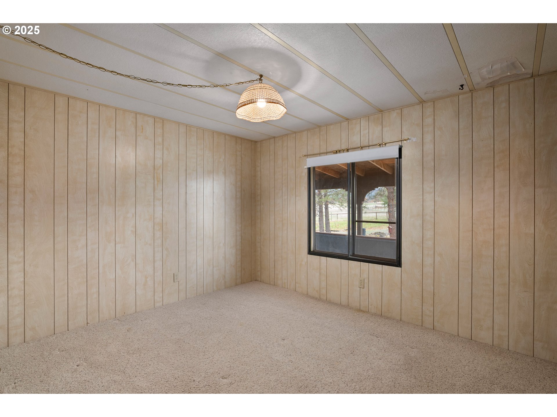 5209 Beagle Road White City, OR 97503 - Photo 19 of 48 a view of an empty room with a window