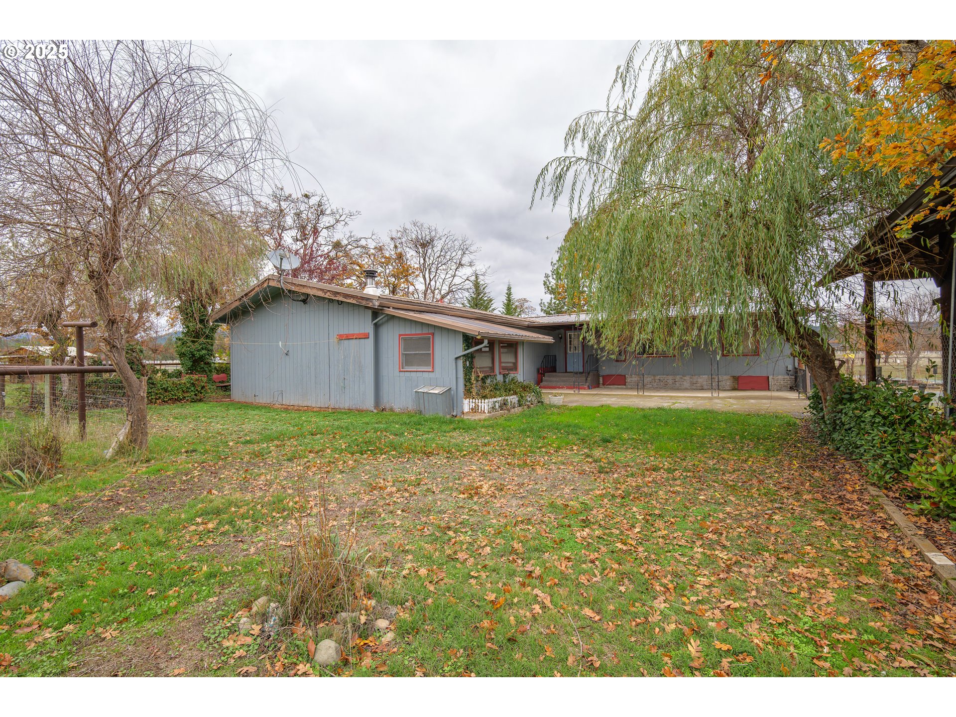 5209 Beagle Road White City, OR 97503 - Photo 31 of 48 a view of a house with backyard and trees