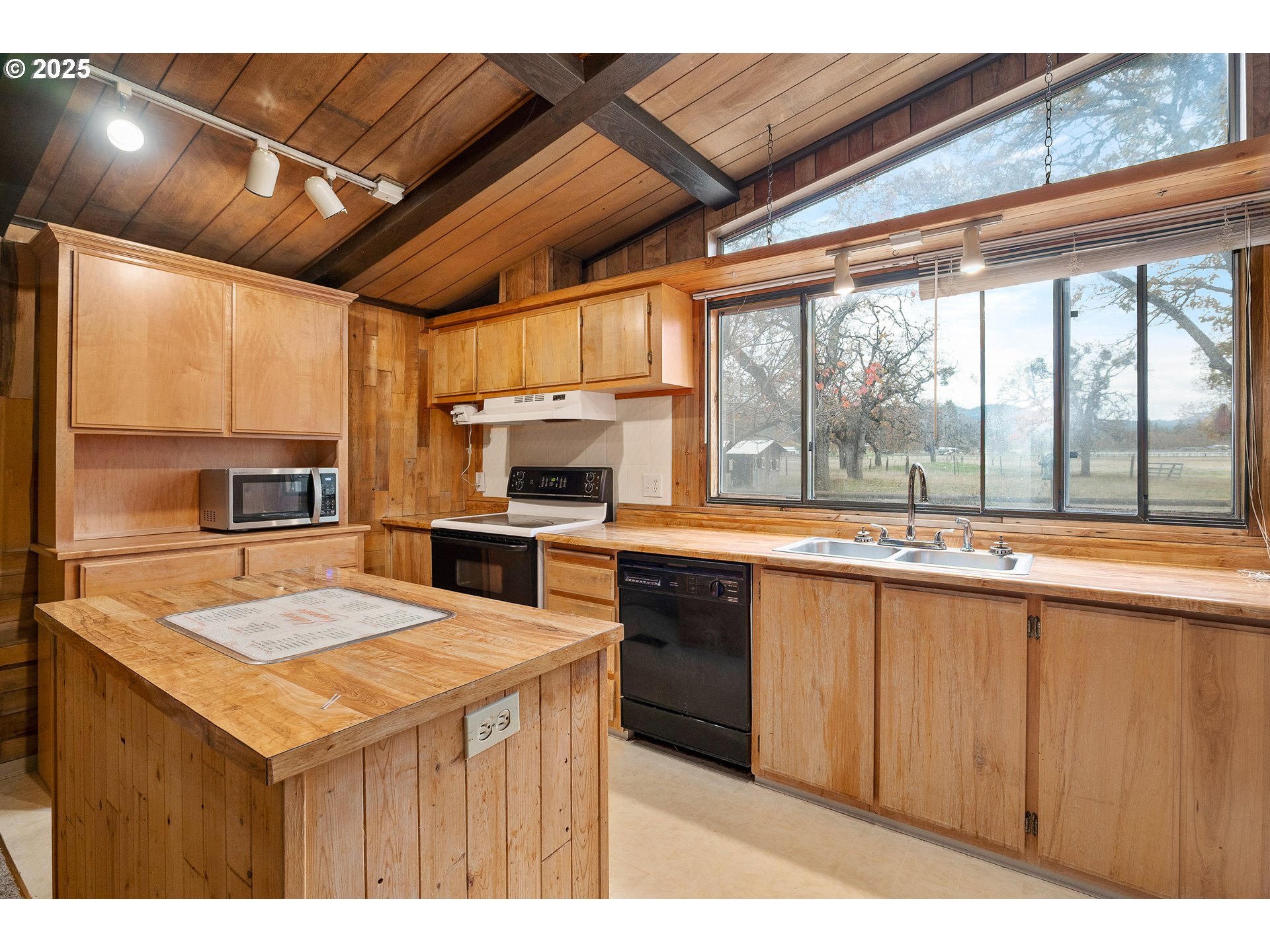 5209 Beagle Road White City, OR 97503 - Photo 10 of 48 a kitchen with a stove a sink and a microwave
