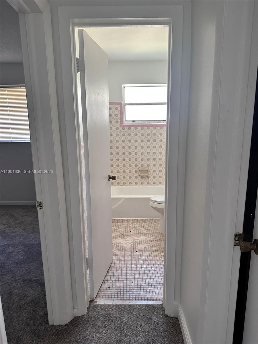 1551 Northeast 143rd Street Miami, FL 33161 - Photo 5 of 5 a view of a hallway