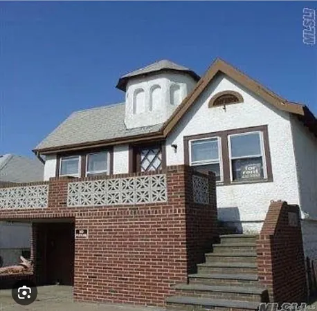 a front view of a house with glass windows