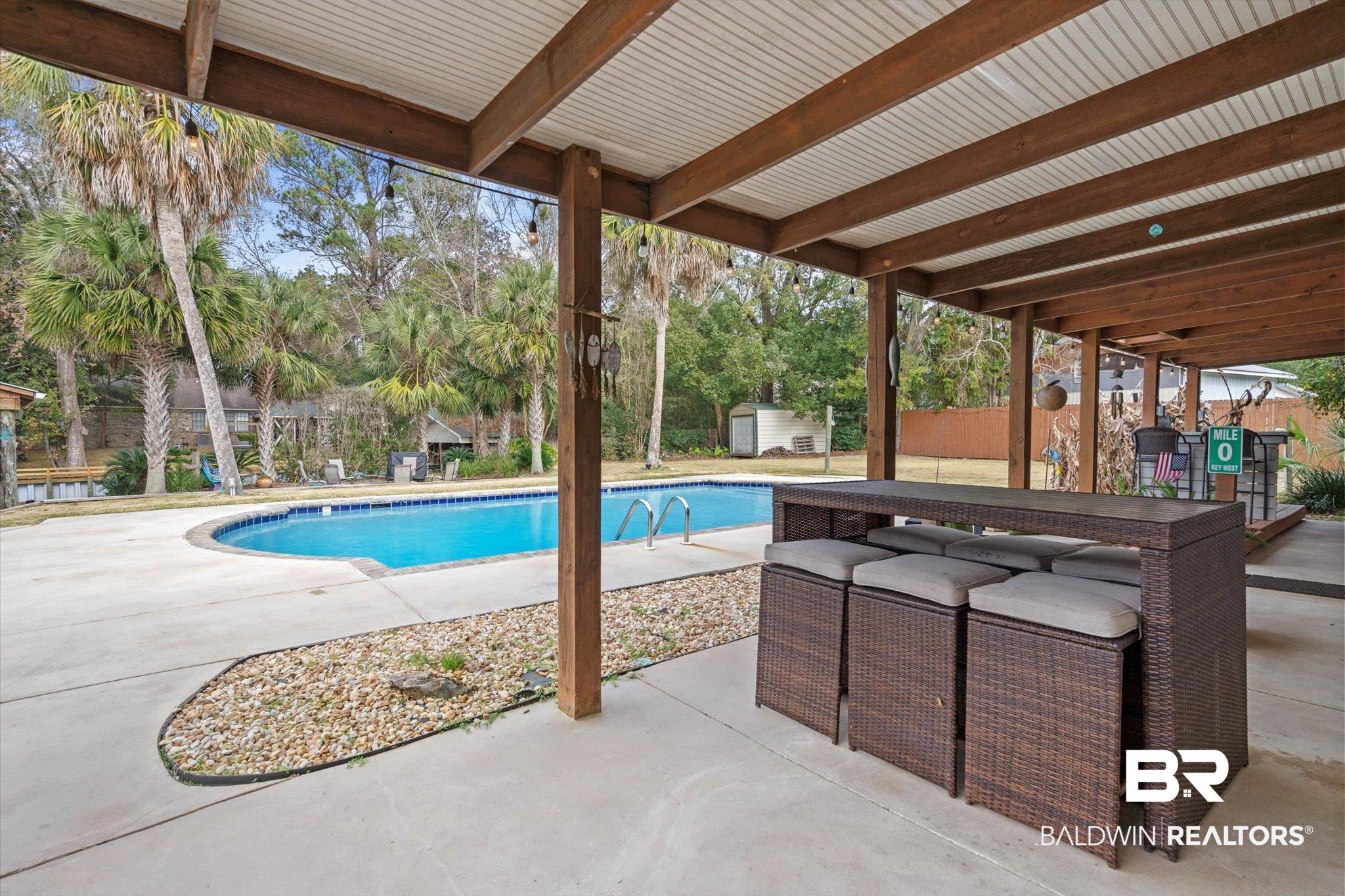 3720 Rabbit Creek Court Theodore, AL 36582 - Photo 24 of 47 Swimming pool with a patio area, a shed, and a fenced backyard