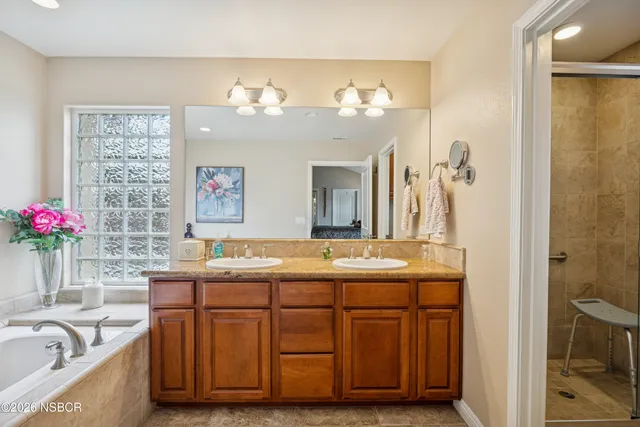 a view of a kitchen with sink and cabinets