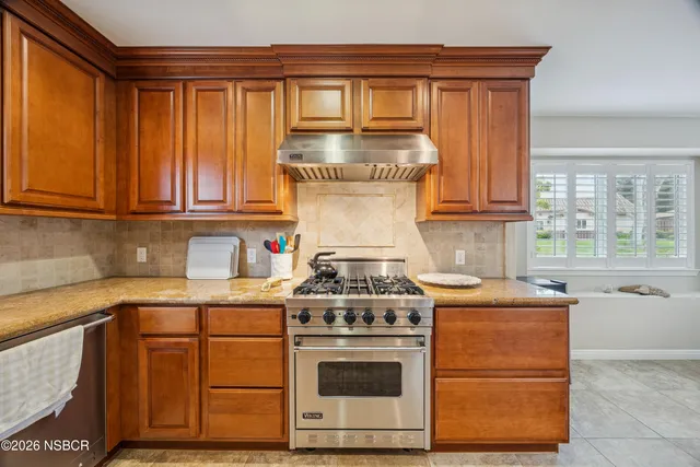 a kitchen with a stove and a sink