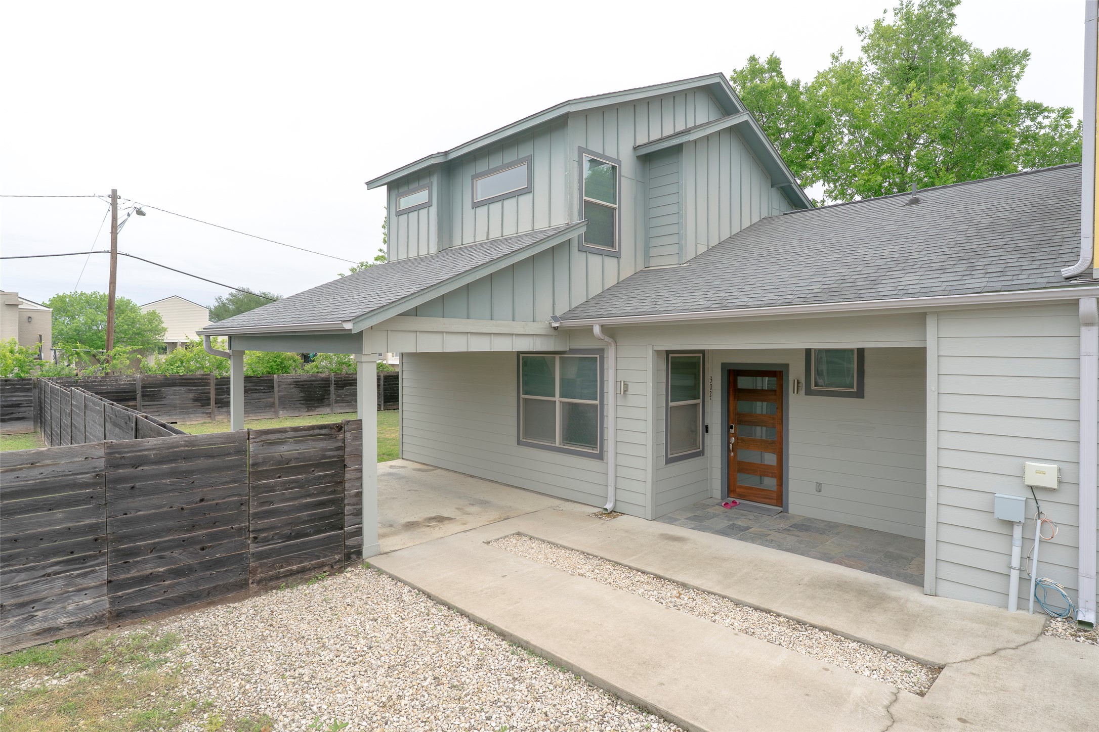 302 Delmar Avenue, Unit B Austin, TX 78752 - Photo 1 of 19 a view of a house with a wooden fence