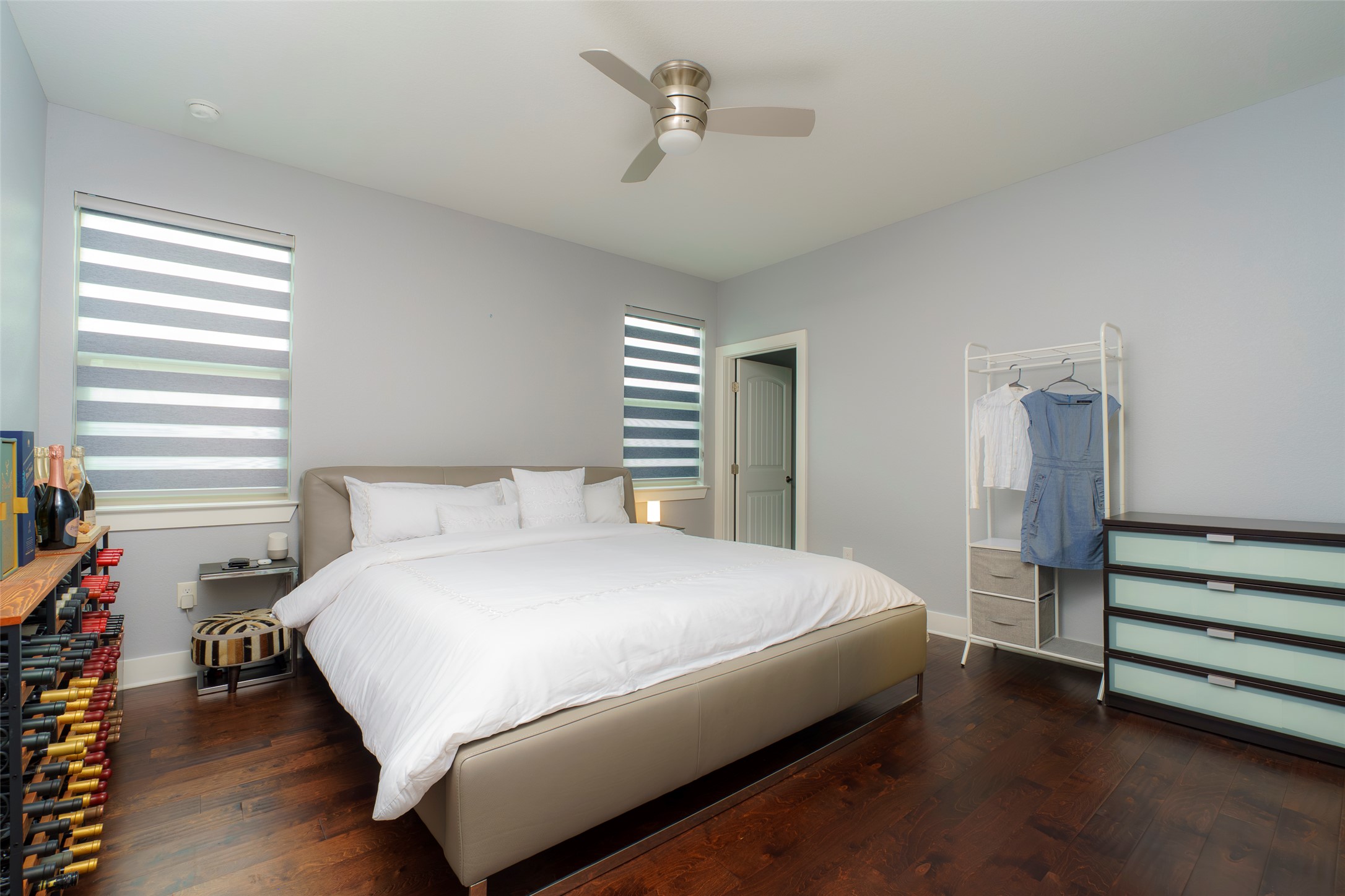 302 Delmar Avenue, Unit B Austin, TX 78752 - Photo 11 of 19 a bedroom with a bed and a chandelier
