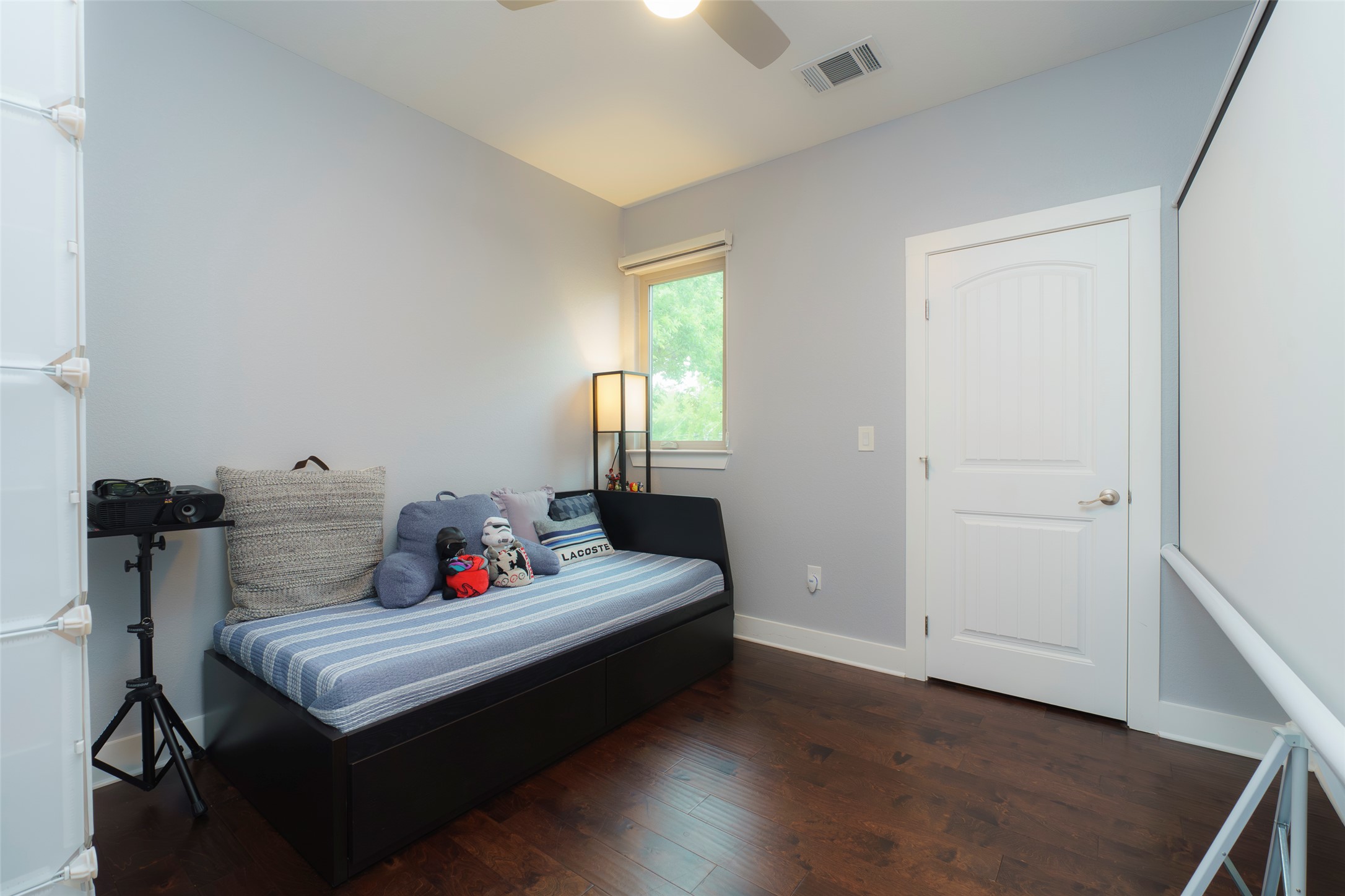 302 Delmar Avenue, Unit B Austin, TX 78752 - Photo 13 of 19 a white bed sitting in a bedroom next to a window