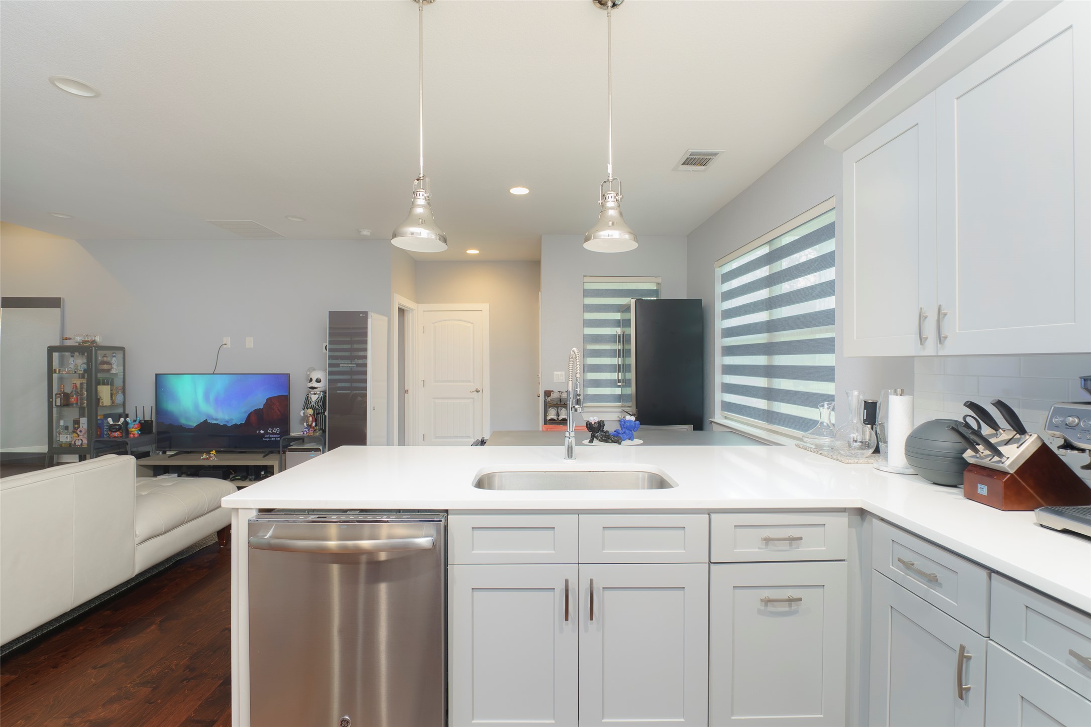302 Delmar Avenue, Unit B Austin, TX 78752 - Photo 19 of 19 a kitchen with a sink a stove a dining table and chairs