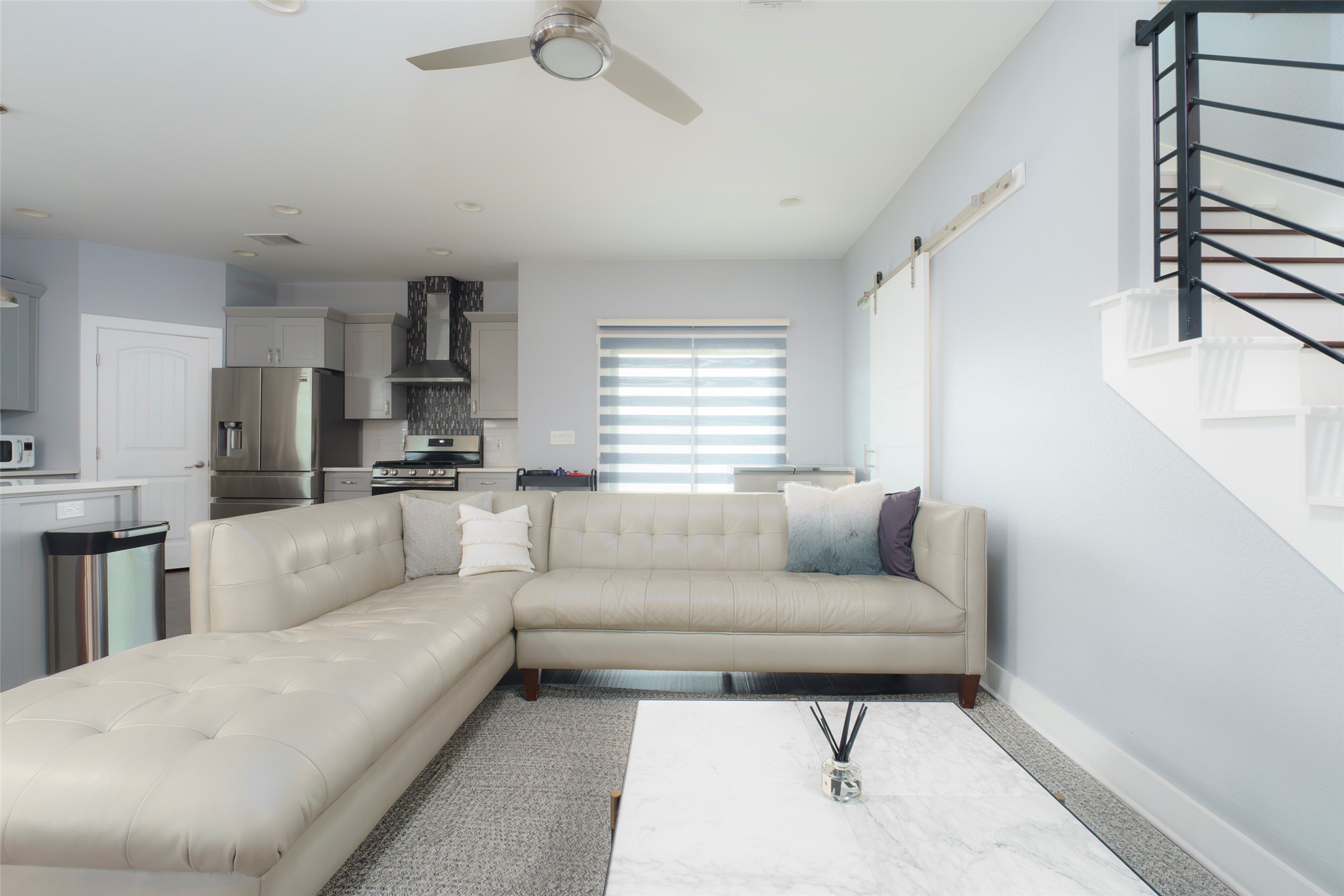 302 Delmar Avenue, Unit B Austin, TX 78752 - Photo 7 of 19 a living room with furniture and a large window