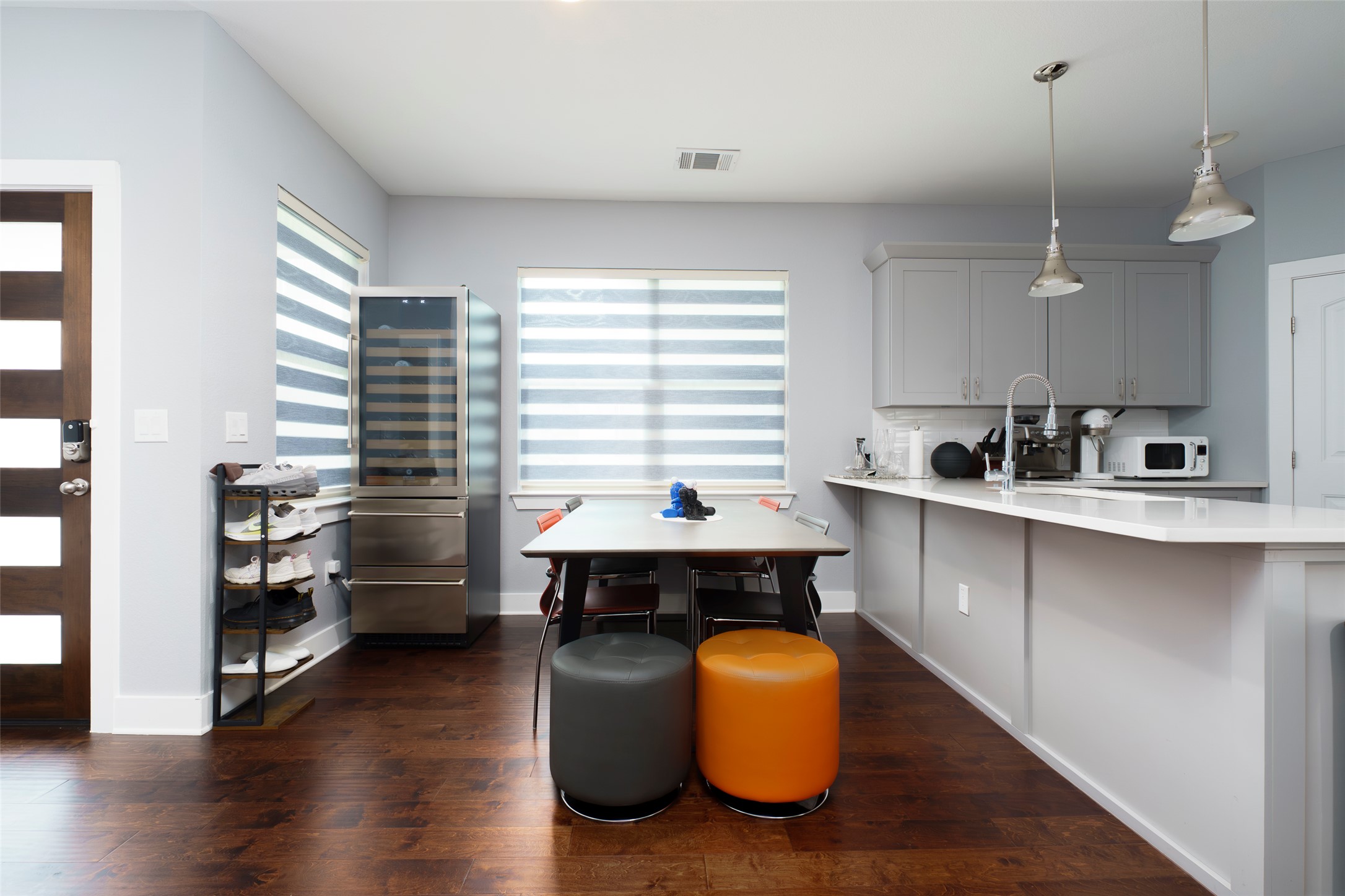 302 Delmar Avenue, Unit B Austin, TX 78752 - Photo 8 of 19 a kitchen with stainless steel appliances granite countertop a sink dishwasher a stove and a refrigerator with wooden floor