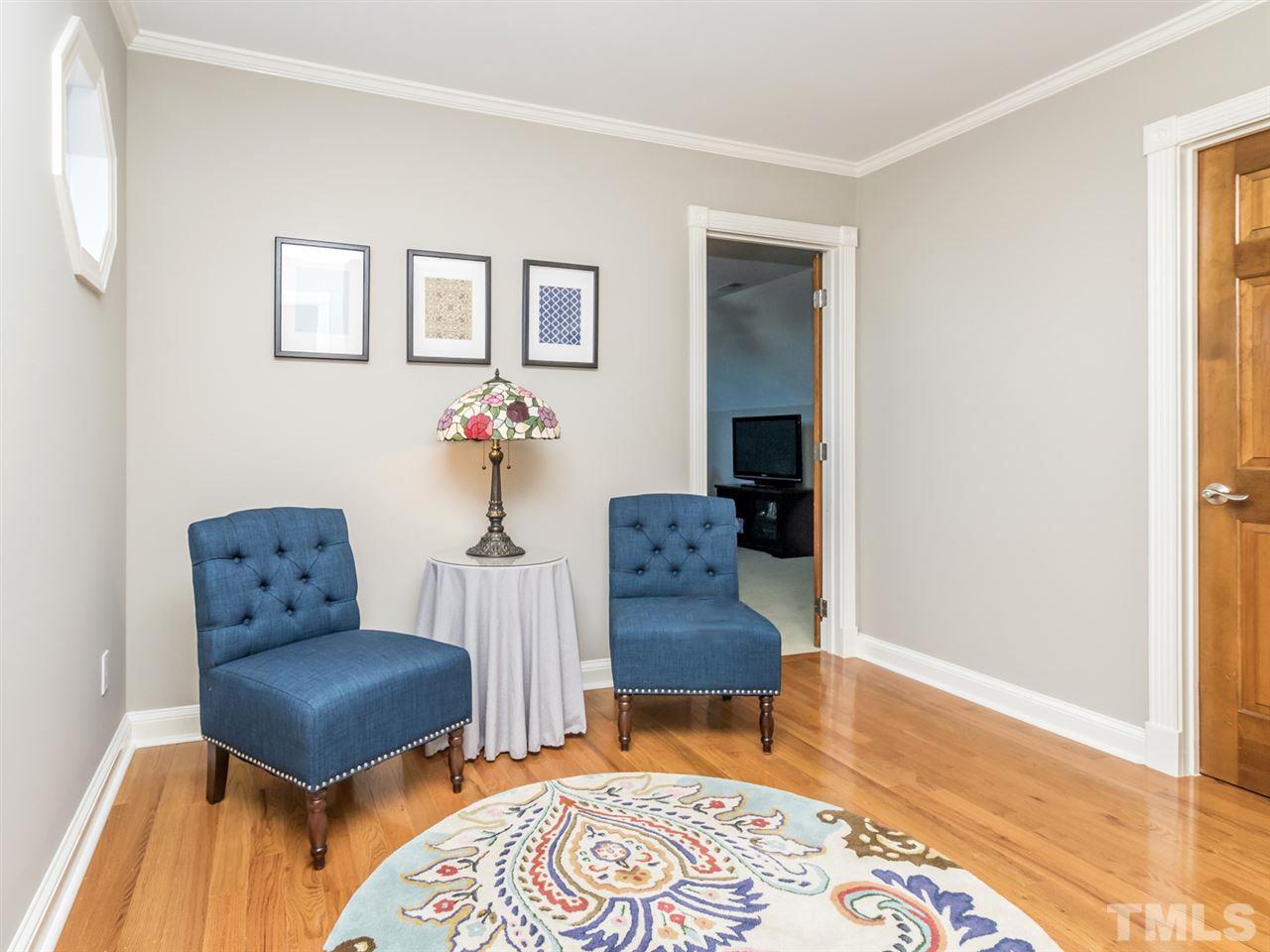4108 Southall Road Raleigh, NC 27604 - Photo 19 of 25 a room with furniture and wooden floor