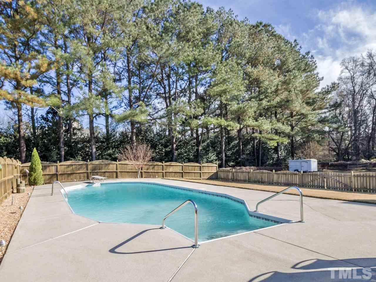 4108 Southall Road Raleigh, NC 27604 - Photo 22 of 25 a view of a swimming pool with lounge chair