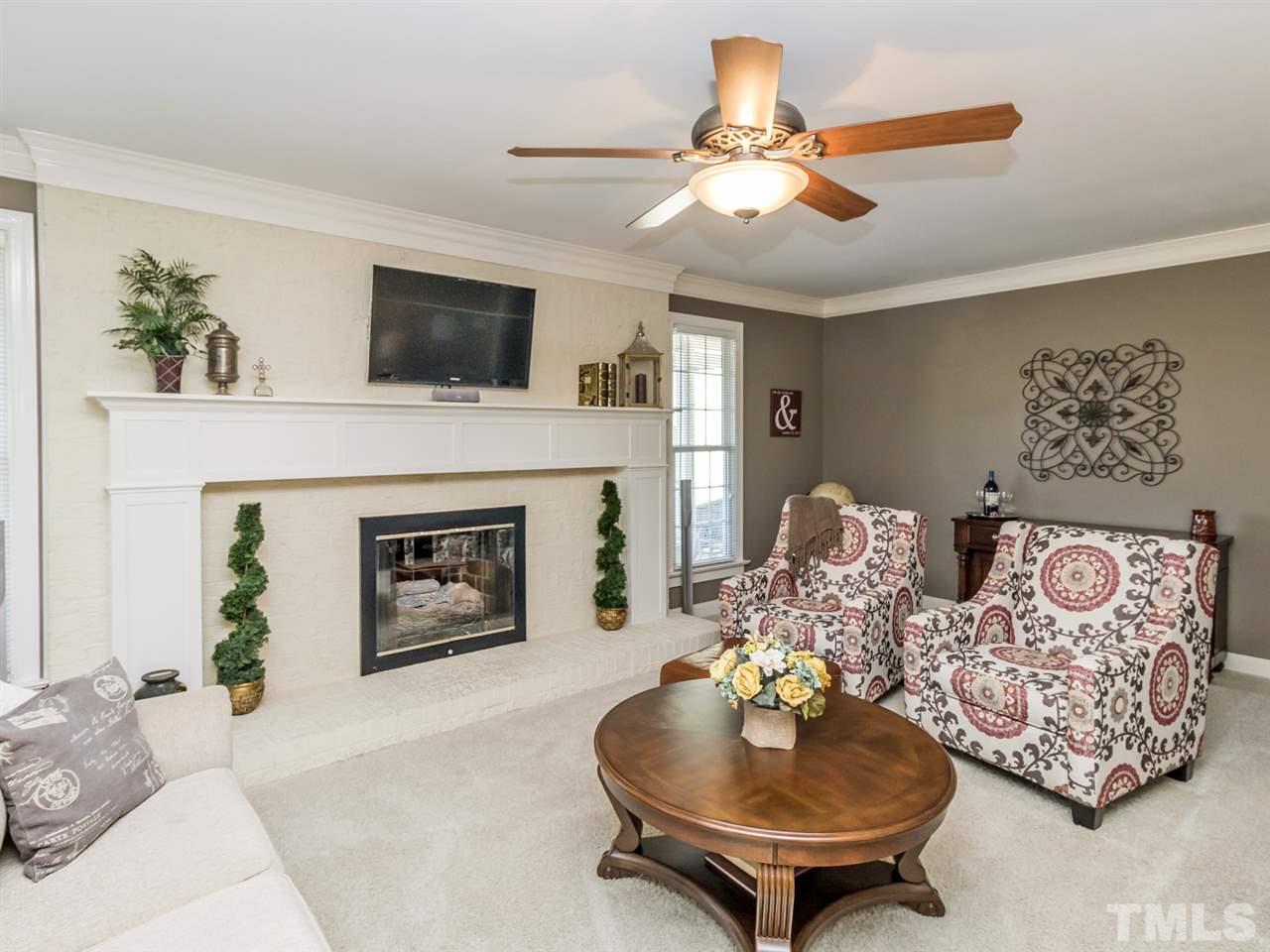 4108 Southall Road Raleigh, NC 27604 - Photo 6 of 25 a living room with furniture and a fireplace