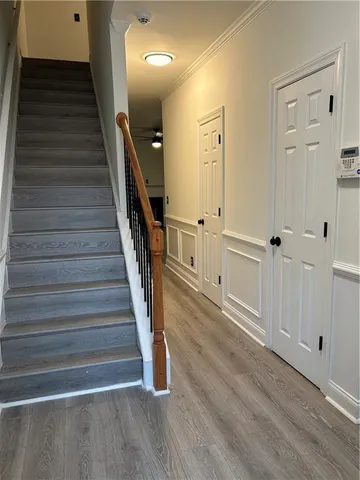 a view of an entryway with wooden floor