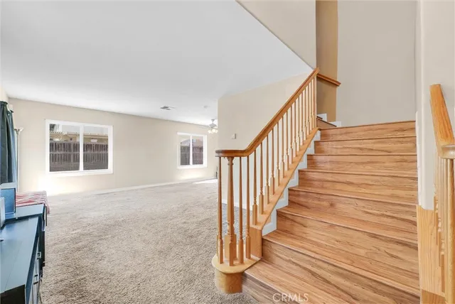 a view of an entryway with wooden floor and door