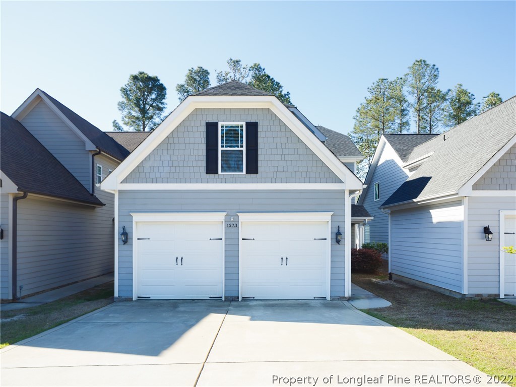 a front view of a house with a garage
