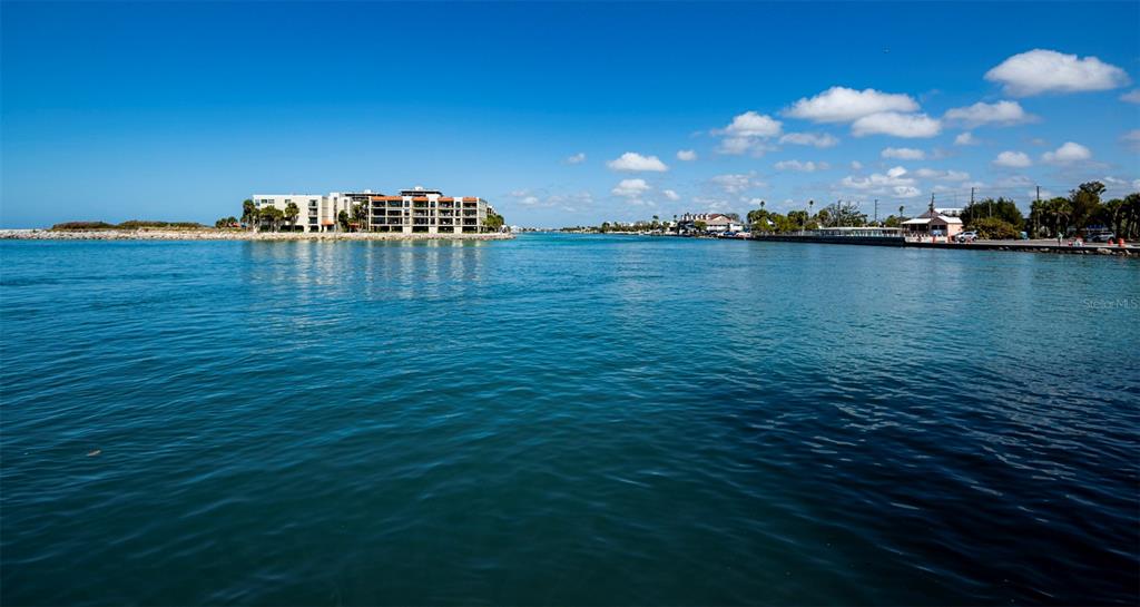 7100 Sunset Way, Unit 810 St. Pete Beach, FL 33706 - Photo 20 of 42 an ocean view with residential houses