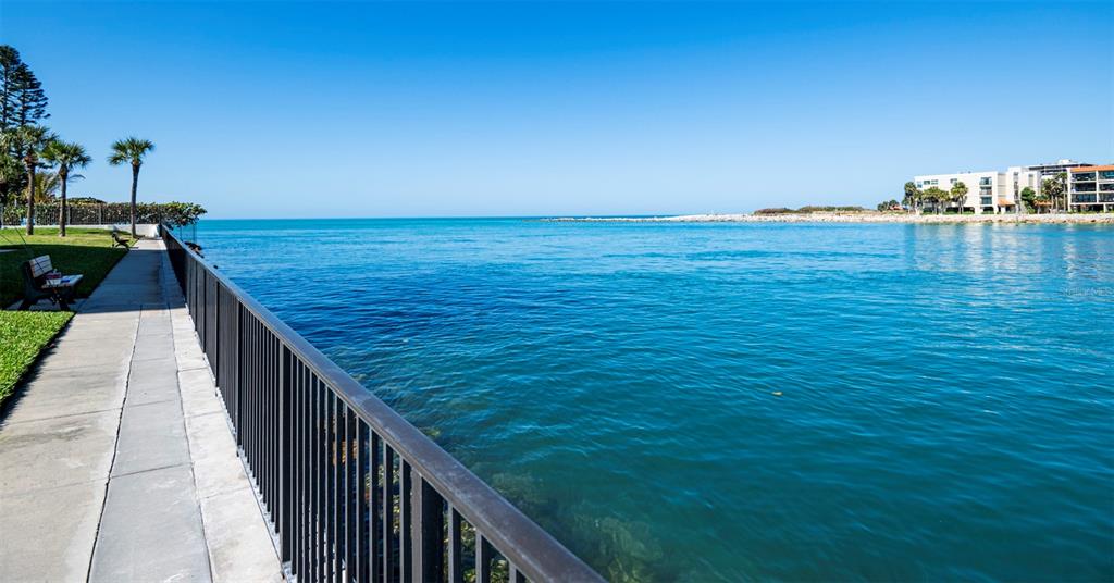 7100 Sunset Way, Unit 810 St. Pete Beach, FL 33706 - Photo 21 of 42 a terrace view with two chairs