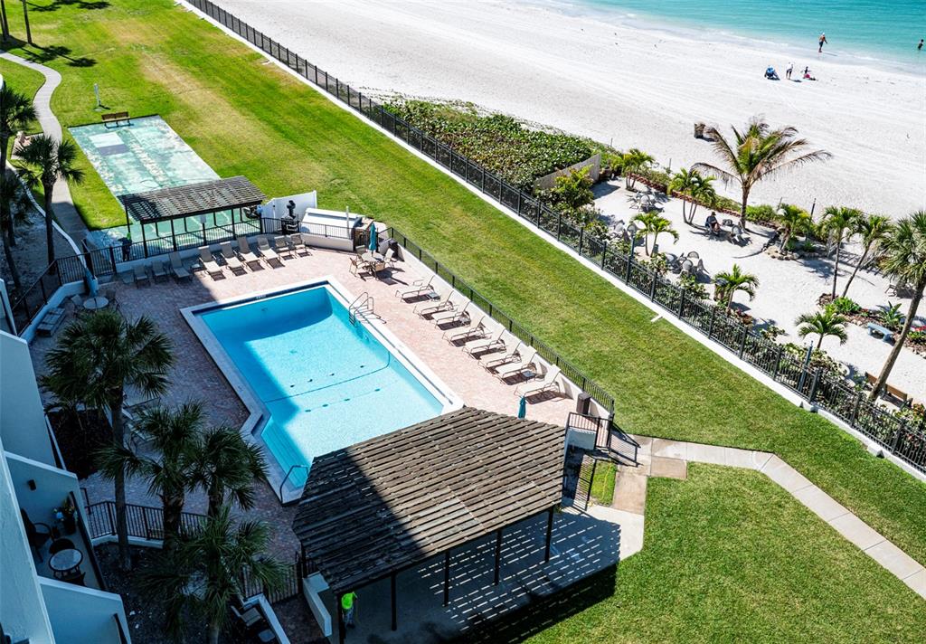 7100 Sunset Way, Unit 810 St. Pete Beach, FL 33706 - Photo 27 of 42 a view of a yard with an outdoor seating