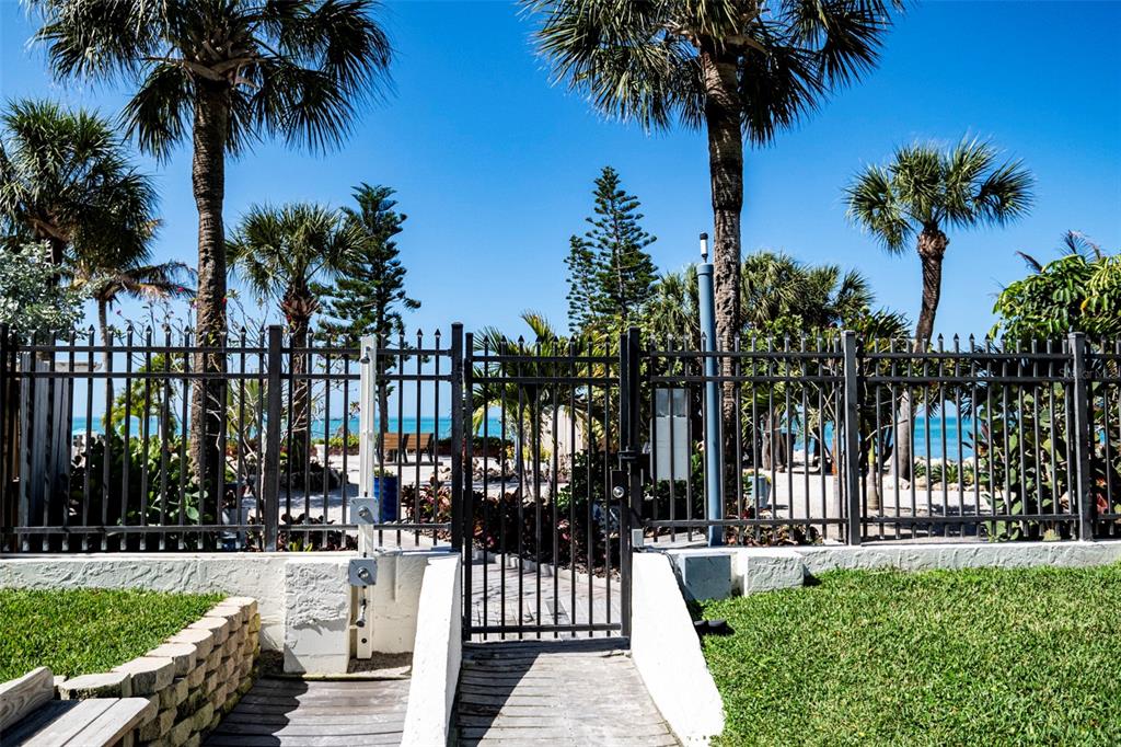 7100 Sunset Way, Unit 810 St. Pete Beach, FL 33706 - Photo 29 of 42 a view of a park with palm trees