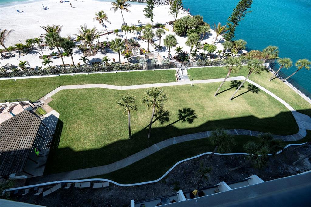 7100 Sunset Way, Unit 810 St. Pete Beach, FL 33706 - Photo 39 of 42 a view of a swimming pool and outdoor seating