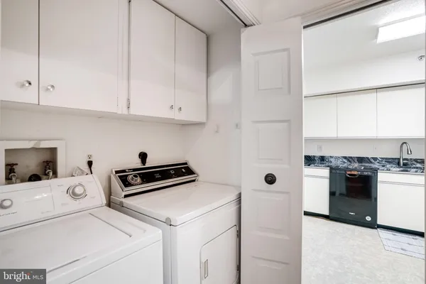 a kitchen with a stove and a refrigerator