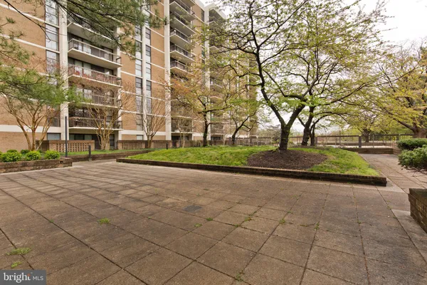 a view of a building with a yard