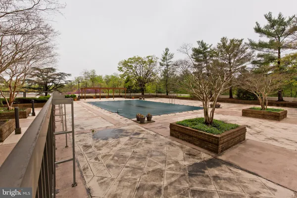 a view of a swimming pool with a patio