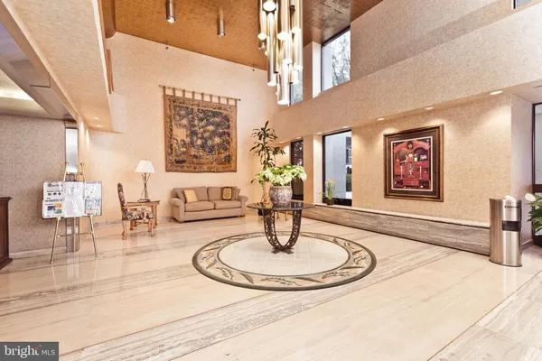 a view of a lobby with furniture and a chandelier