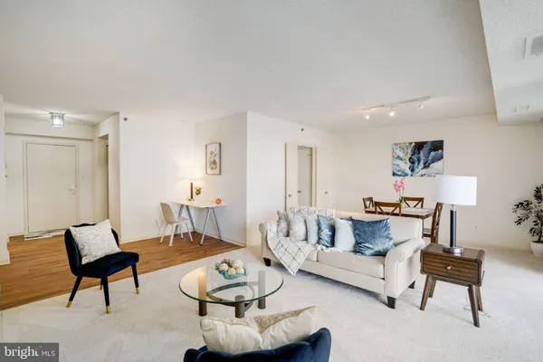 a living room with furniture and a table