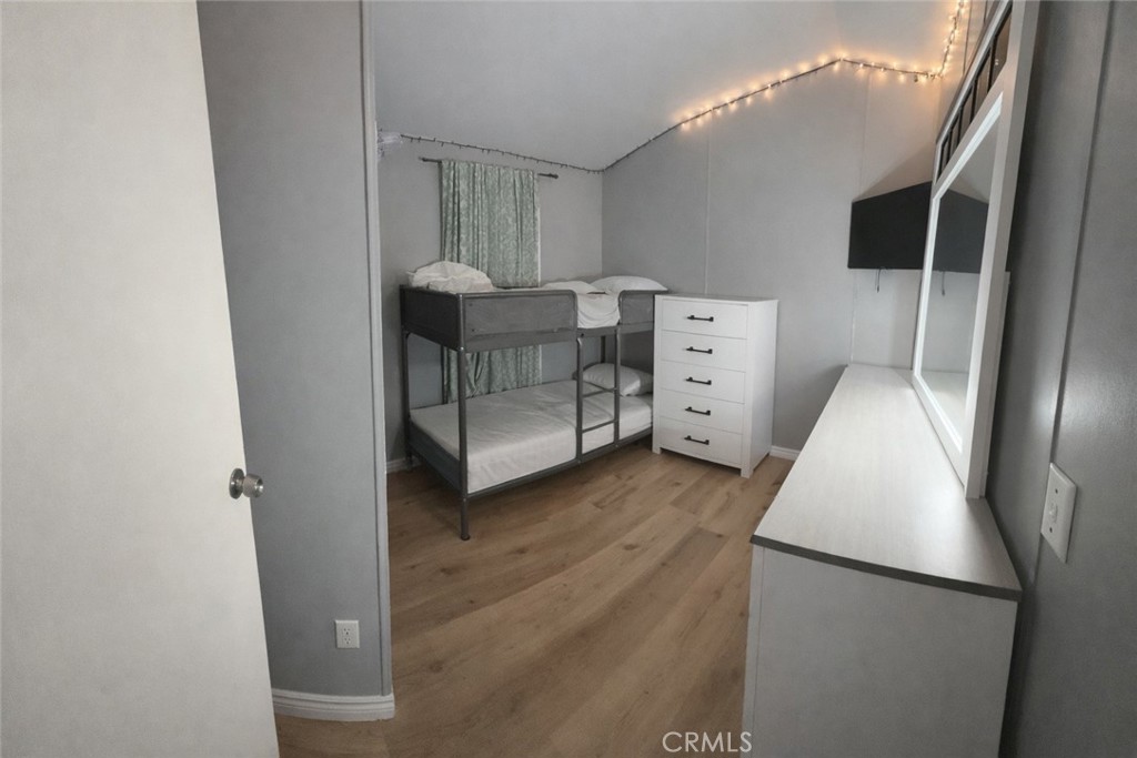 135 North Pepper Avenue, Unit 7 Rialto, CA 92376 - Photo 8 of 8 a view of walk in closet with empty racks