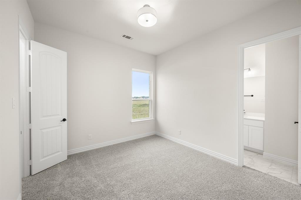 211 Marie Lane Waxahachie, TX 75167 - Photo 11 of 24 an empty room with windows and closet
