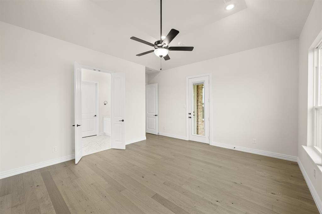 211 Marie Lane Waxahachie, TX 75167 - Photo 17 of 24 an empty room with fan and a ceiling fan