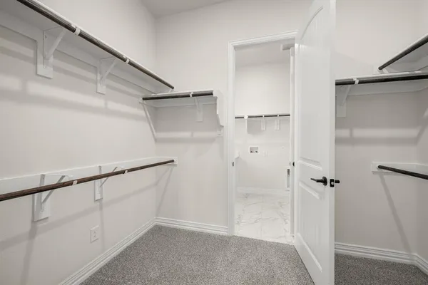a view of an empty walk in closet