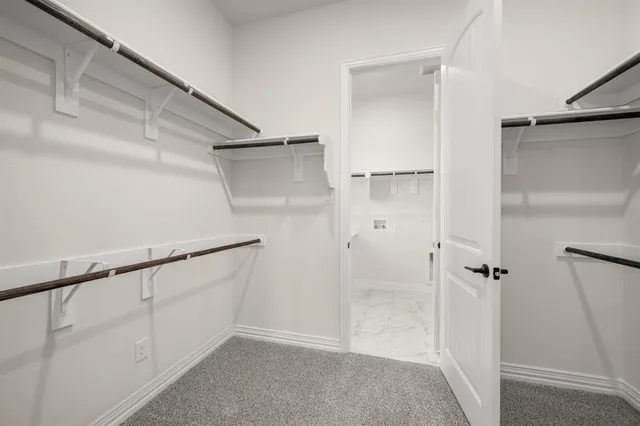 a view of an empty walk in closet