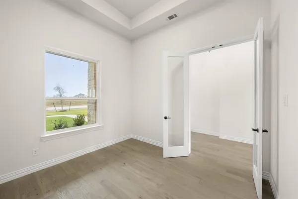 a view of an empty room with a window