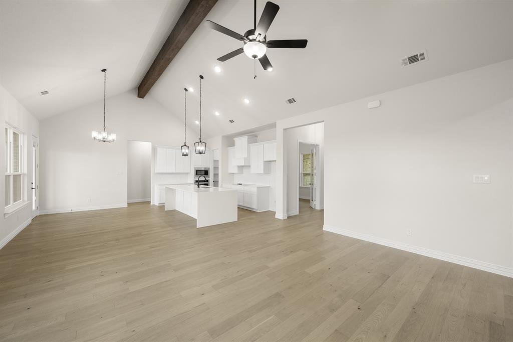 211 Marie Lane Waxahachie, TX 75167 - Photo 5 of 24 a view of a kitchen with a sink and refrigerator